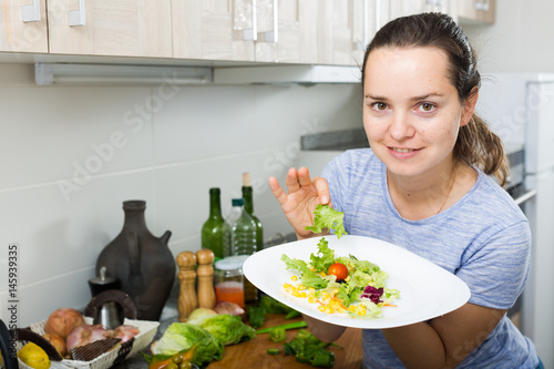 woman serving salad