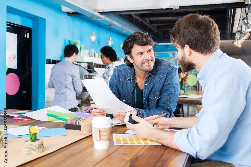 Man reading document business people colleagues working diverse mix race group casual wear modern office businesspeople sitting desk Man reading document business people colleagues working diverse mix race group casual wear modern office businesspeople sitting desk