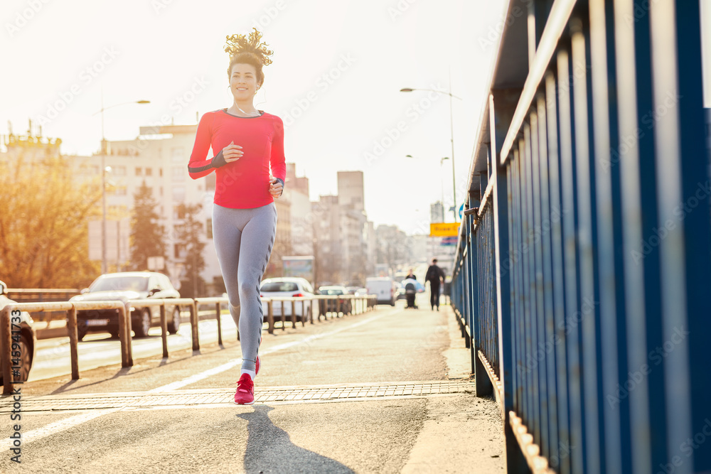Young beautiful woman running in the morning Young beautiful woman running in the morning