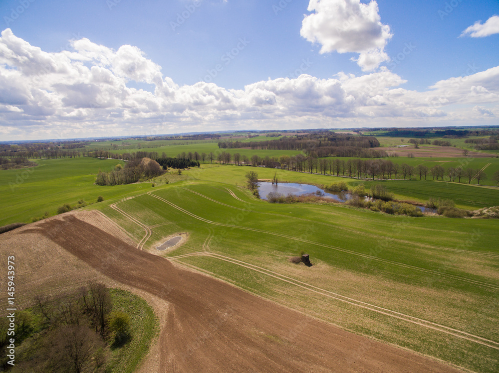 Aerial view of beautiful agricultural fields and meadows in the german countryside. It is a clear, bright Spring day Aerial view of beautiful agricultural fields and meadows in the german countryside. It is a clear, bright Spring day