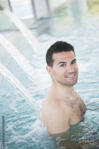 young man enjoying thermal bath in thalassotherapy center
