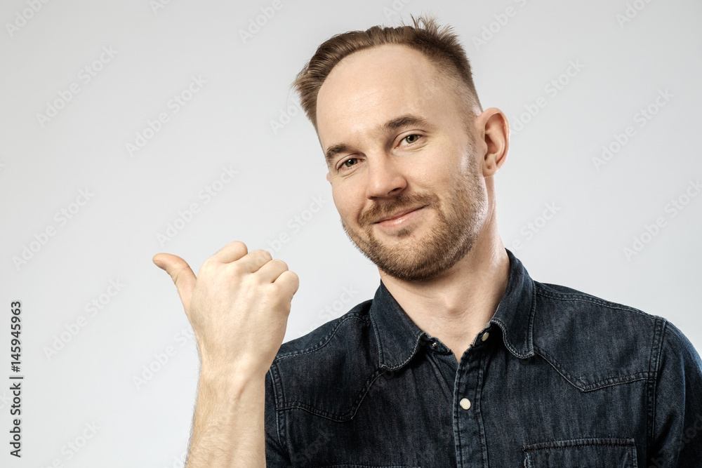 Happy young handsome man gesturing