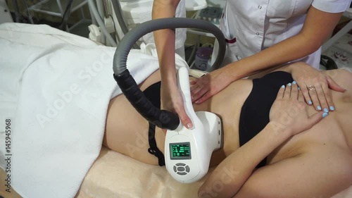 Hardware cosmetology.Vacuum massage in the beauty salon.beautiful woman receiving a massage.Cosmetology procedure