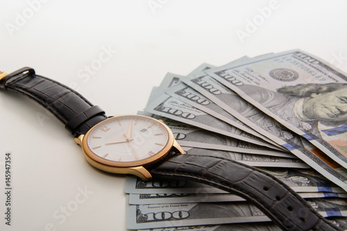 Time is money. Watch and dollars