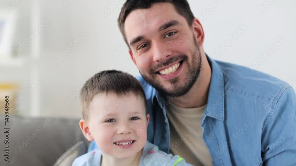 happy father and little son laughing at home happy father and little son laughing at home