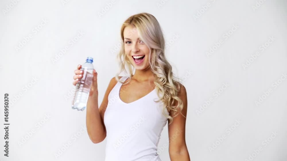 happy beautiful young woman with bottle of water happy beautiful young woman with bottle of water