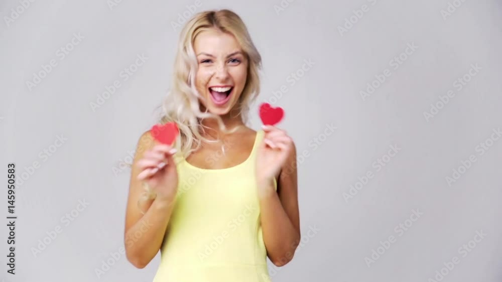 happy young woman with red paper hearts happy young woman with red paper hearts