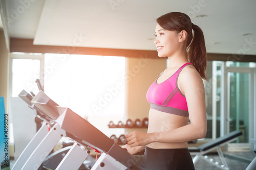 woman stand on treadmill