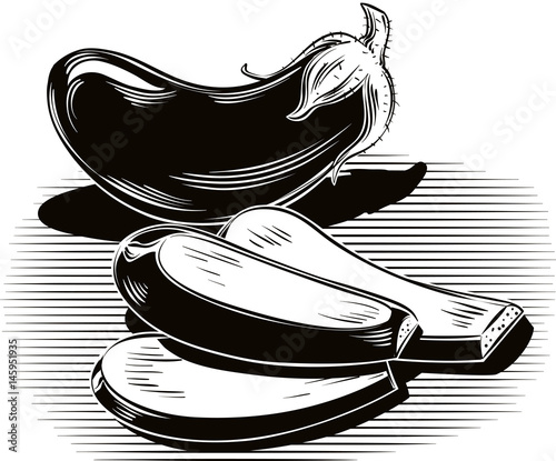 ripe aubergine, resting on a table.