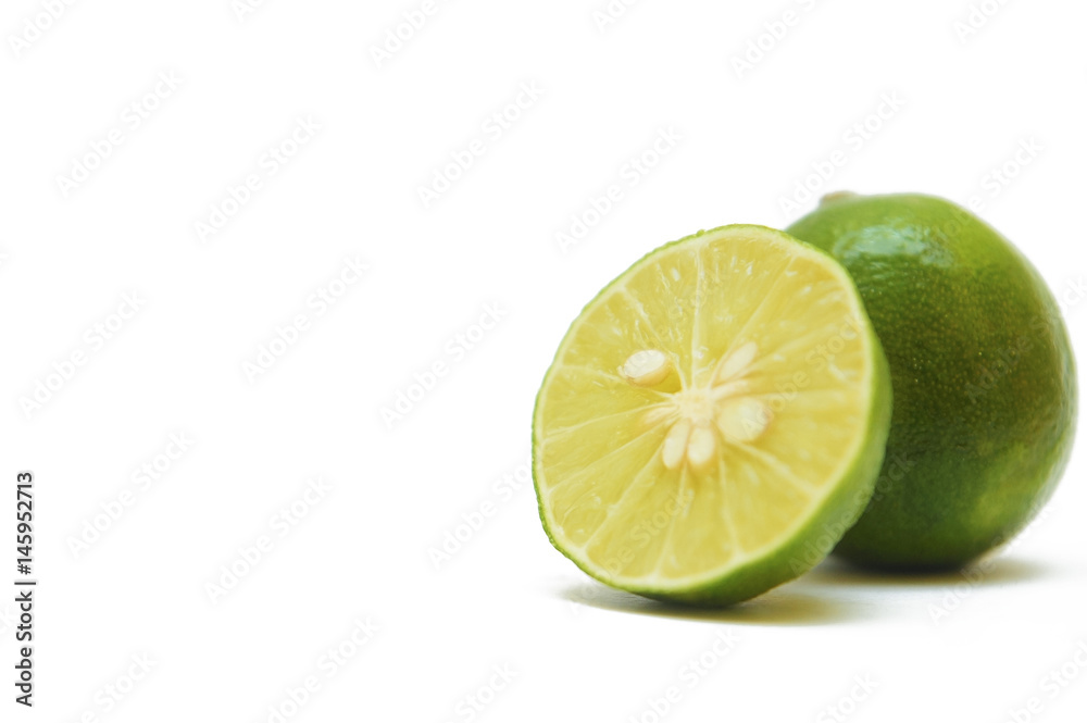 fresh green lime over white background