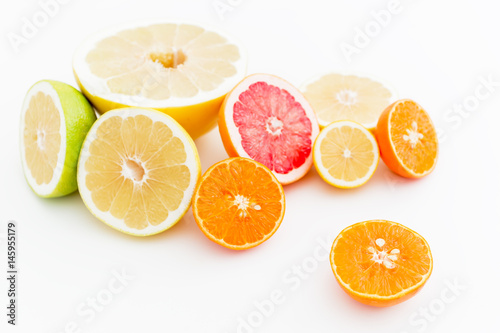 Food pattern of fresh juicy citrus on white background. Flat lay, top view.