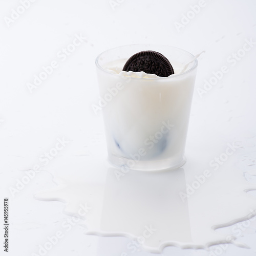 Chocolate cookie in splashing milk