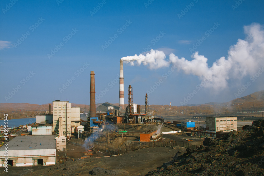 Smoke from factory chimney in an industrial plant. Smoke from factory chimney in an industrial plant.