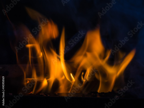 Flame and smoke of fire on a black background closeup