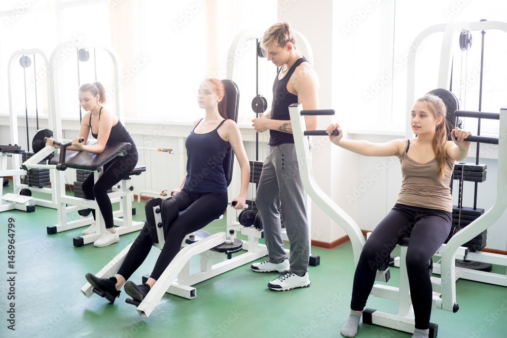 Girl doing exercises in gym