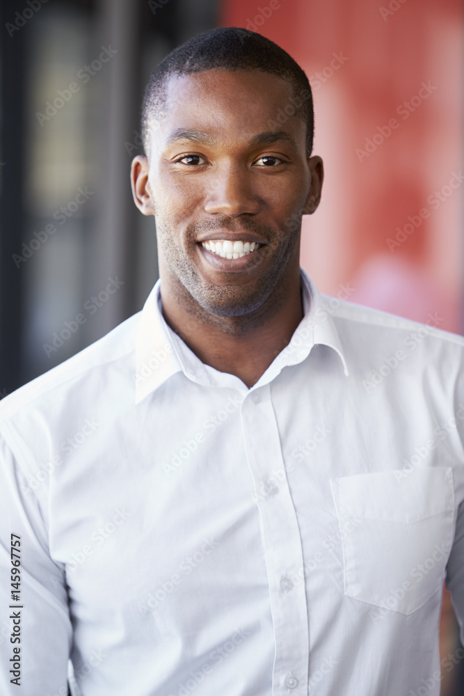 Vertical portrait of young black man smiling Vertical portrait of young black man smiling