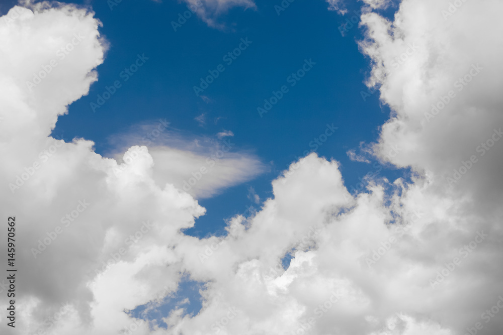 Blue sky and multiple heavy clouds on spring midday. Nature background. Blue sky and multiple heavy clouds on spring midday. Nature background.