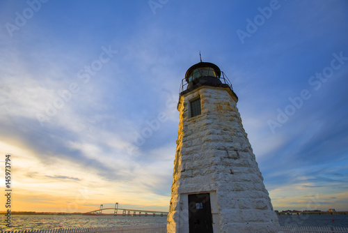 Sunset over the Goat Island Lighthouse, Newport, RI with Rose Island Light House as a backdrop.