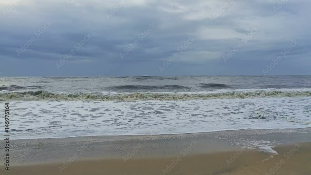 Stormy sea waves roll to the beach Stormy sea waves roll to the beach