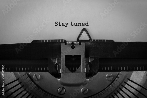 Text Stay Tuned typed on retro typewriter