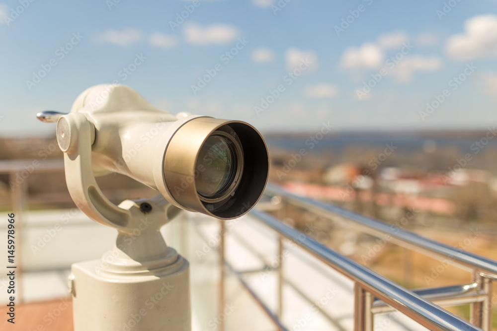 Stationary observation binoculars in sity close up Stationary observation binoculars in sity close up