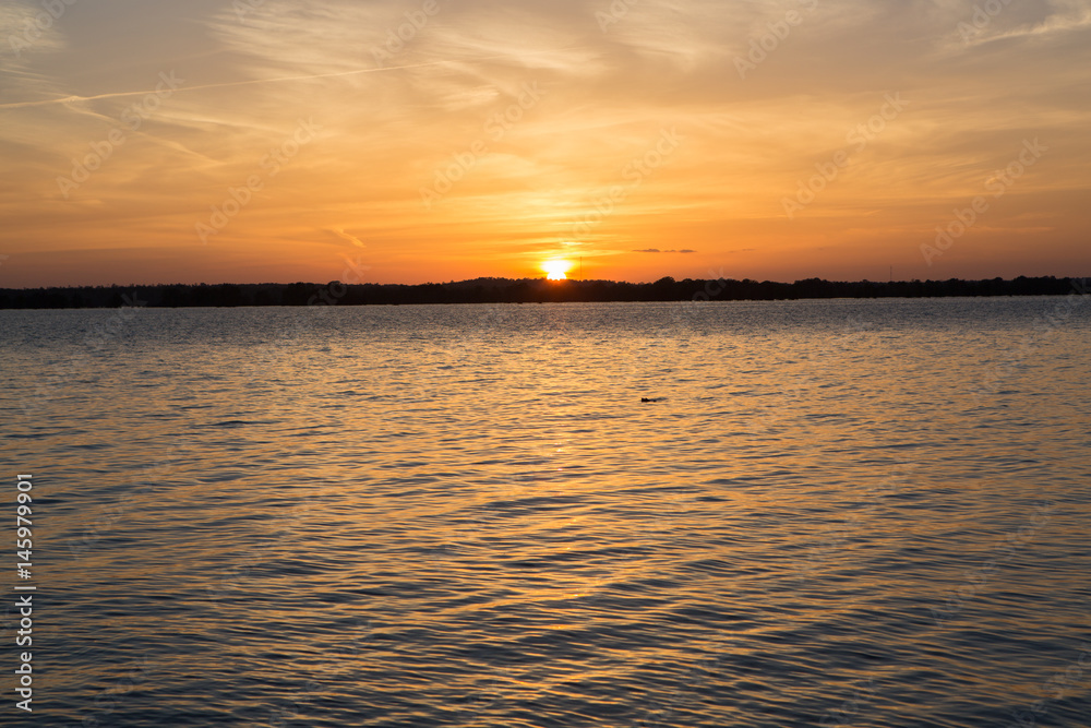 Sunset in lake at Martin Dies state park, Texas