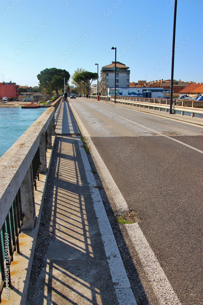 On the bridge of Grado. It connects the mainland with the peninsula of Grado.  Northeastern Italy, Europe.