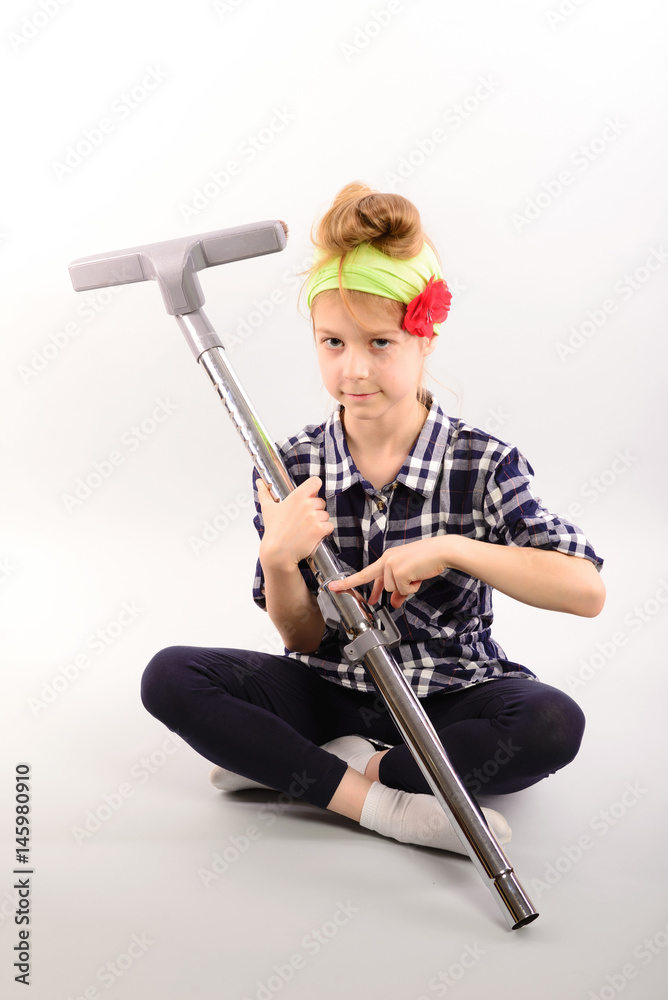 Fototapeta premium Little girl doing housework, isolated photo on white background