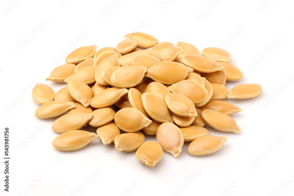 Heap of pumpkin seeds isolated .
