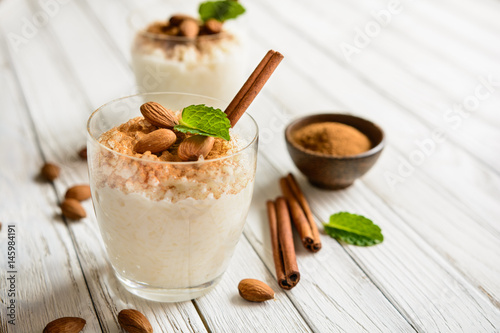 Creamy rice pudding topped with cinnamon and almond