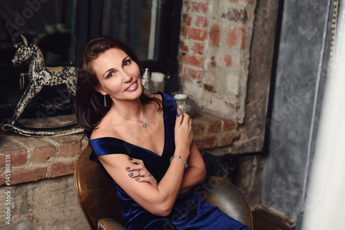 Wallpaper Mural Seductive woman 50 years old posing in photo studio Torontodigital.ca