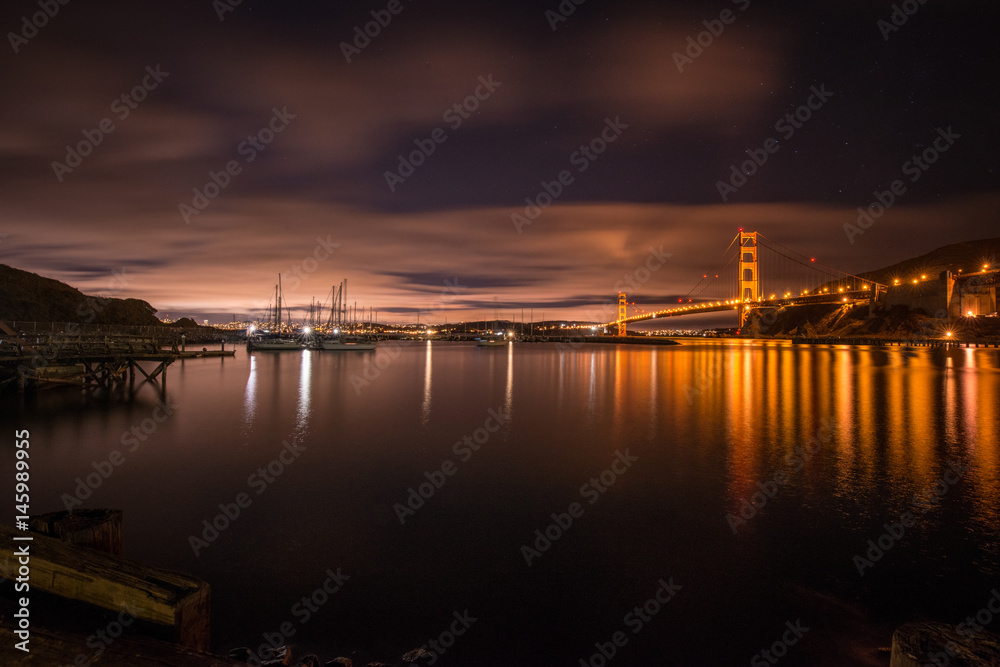 Fototapeta premium Sailboats Sway in evening sky of a San Francisco Harbor