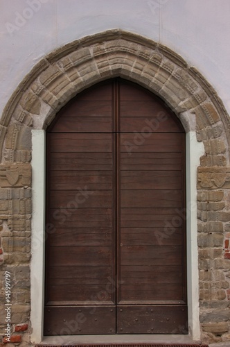 Ancient door in Acqui Terme, Italy