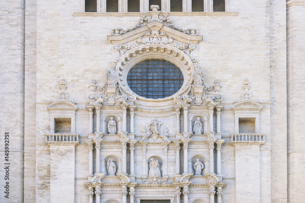 Church wall with round window in Girona