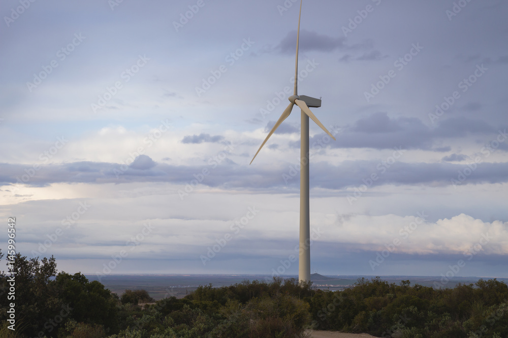 one windmill generating clean and renewable power, environment and ecology background and concept one windmill generating clean and renewable power, environment and ecology background and concept