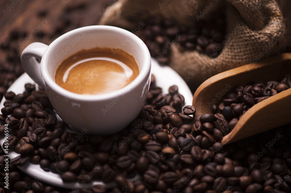 Fototapeta premium Coffee on the coffee beans background