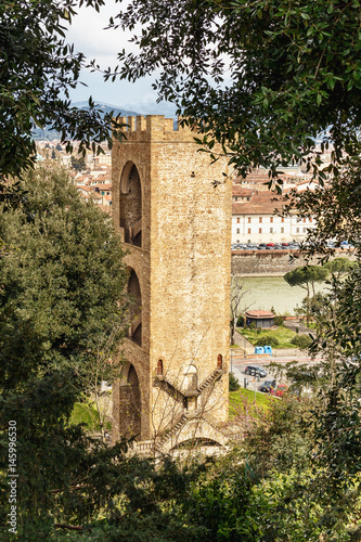 view of the watch tower on the banks of the river Arno in Florence