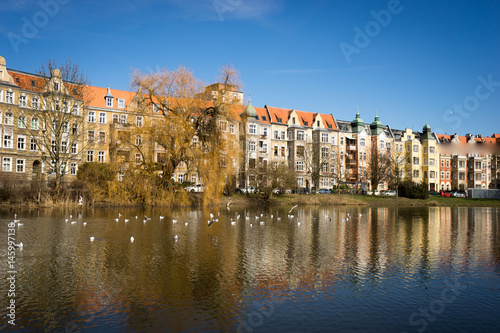 old tenement buildings by the lake