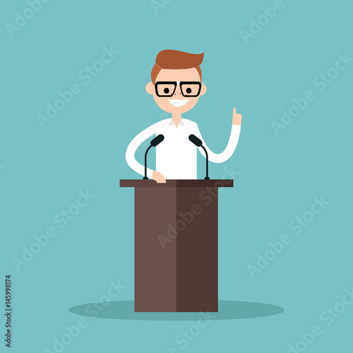 Nerd boy standing behind the tribune and pointing his finger up / flat editable vector illustration