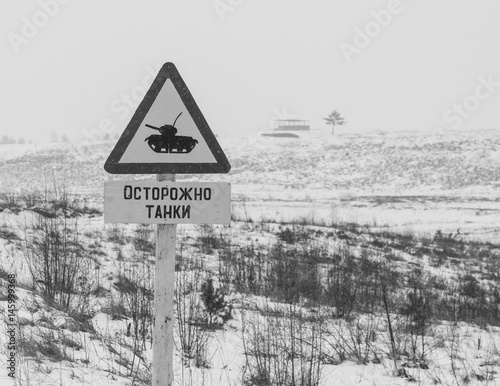 Winter snows, the Sign on the ground "beware of Tanks".