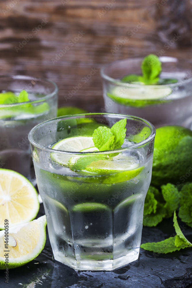 Mojito cocktail in a bur on a rustic table, selective focus Mojito cocktail in a bur on a rustic table, selective focus