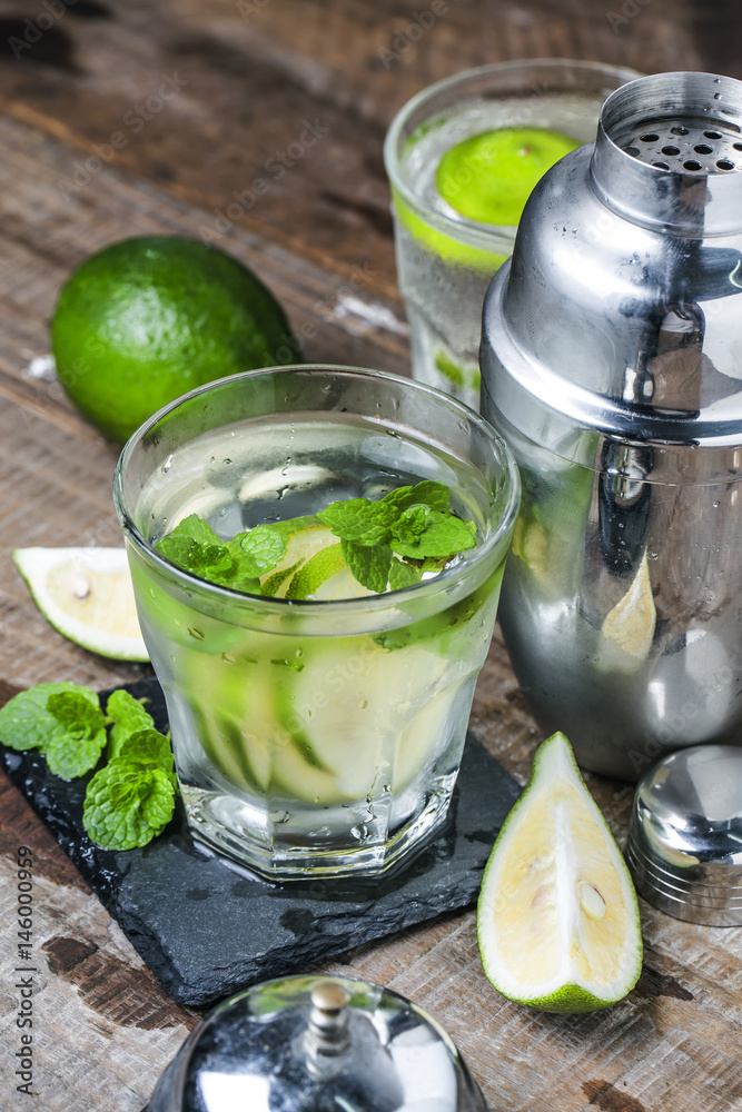 Fototapeta premium Mojito cocktail in a bur on a rustic table, selective focus