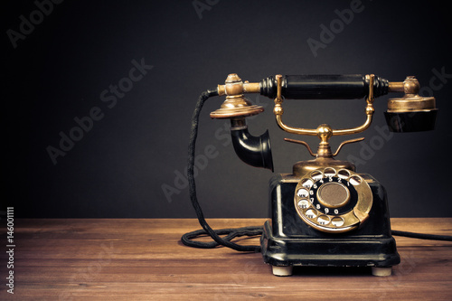 Vintage old telephone on wood table