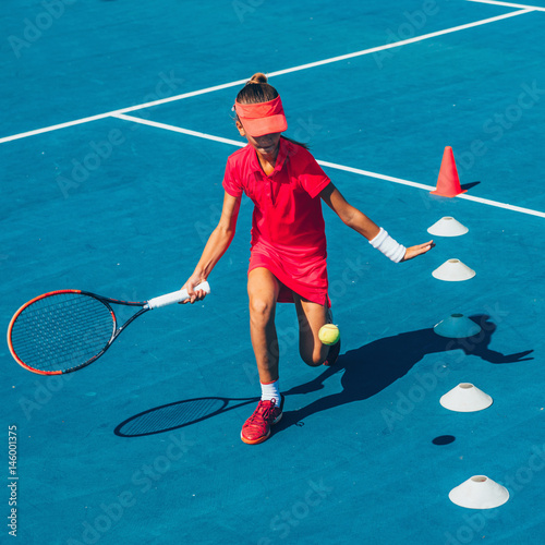 Girl on tennis training © Microgen