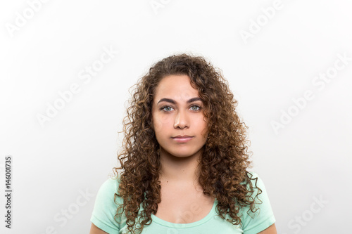 Studio portrait of a young woman contemplating