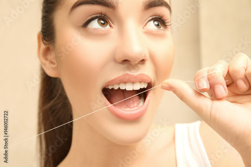 Beautiful woman brushing te...