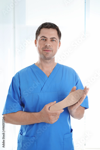 Male orthopedist with insol...