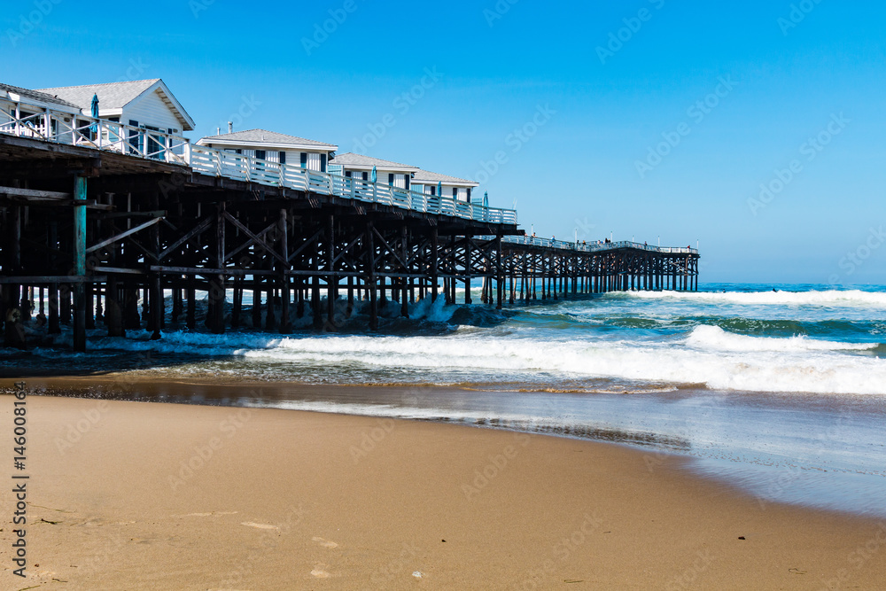 Pacific Beach in San Diego, California with vacation cottages on top of Crystal Pier.