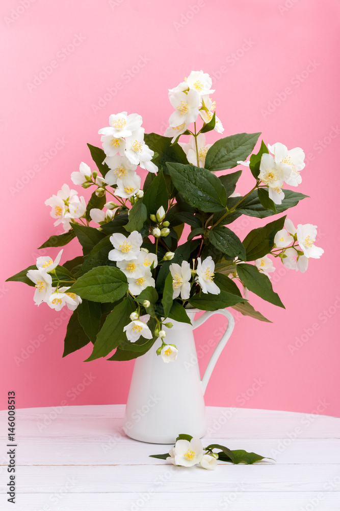 Fototapeta premium Fresh jasmine flowers in a vase