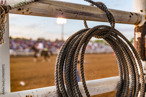 Rope tied to a fence at a rodeo photo